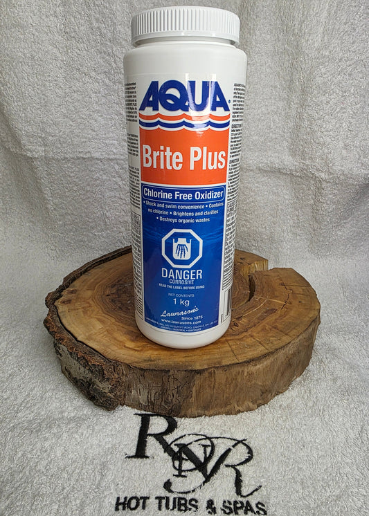 Aqua Brite Plus product on a wooden block with a gray background