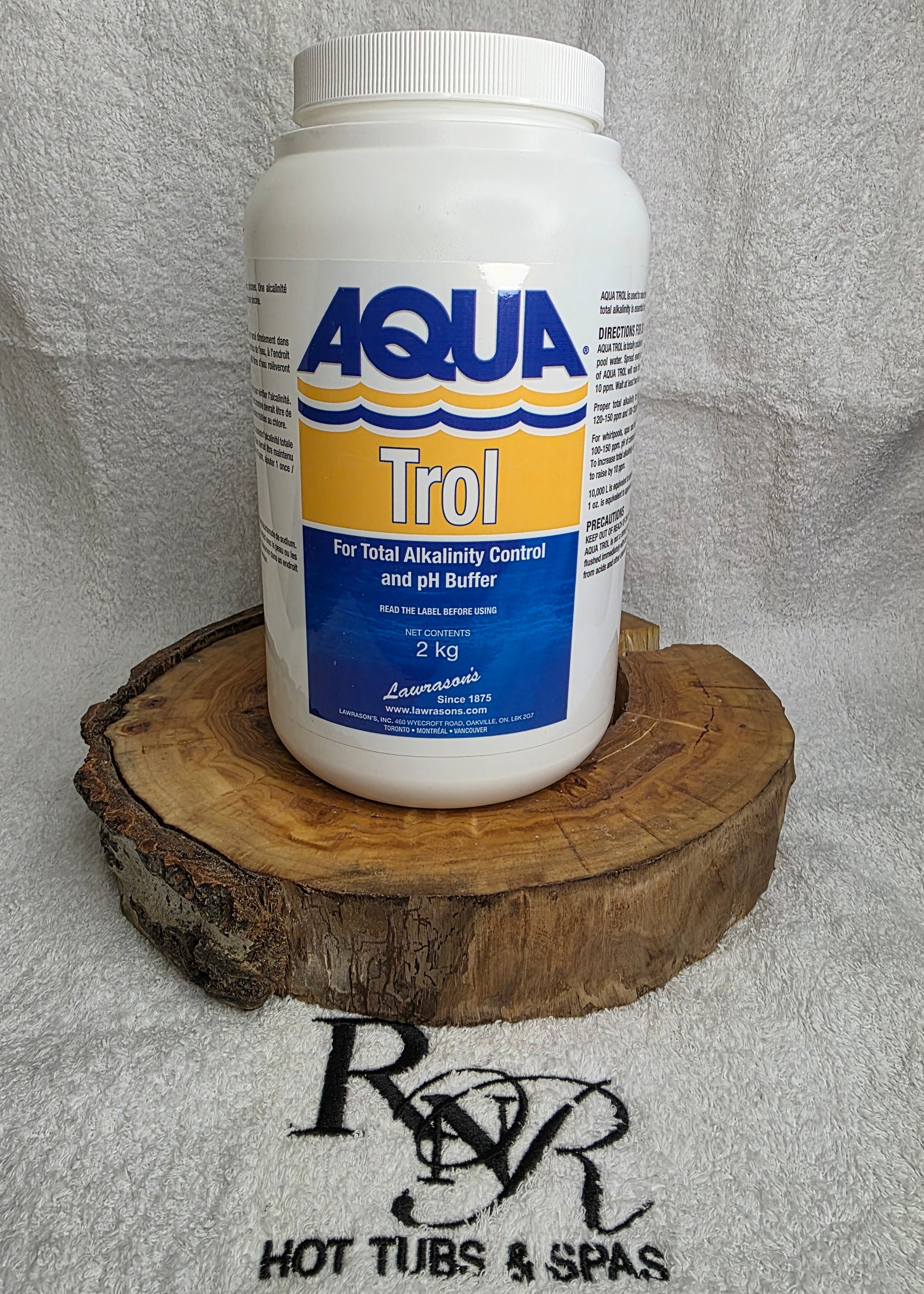 Aqua Trol container on a wooden block with a logo in the background