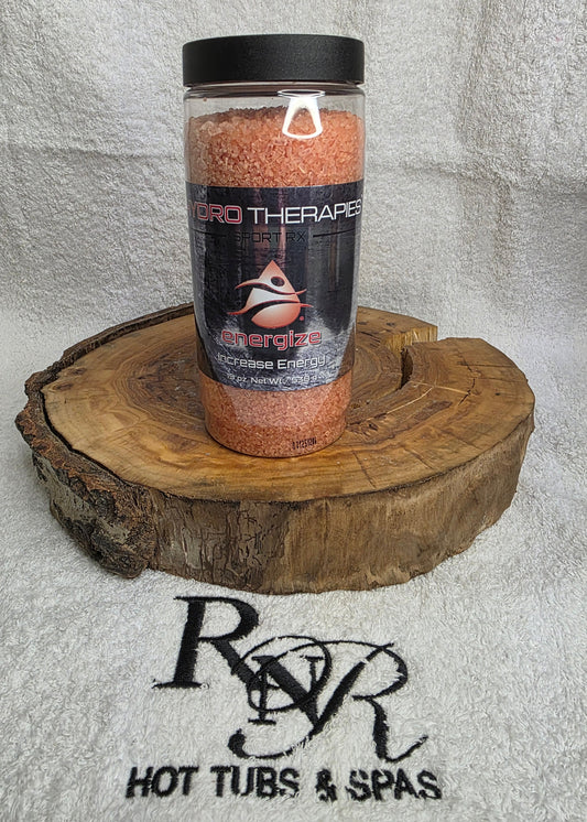 Bottle of Hydro Therapies on a wooden block with RnR Hot Tubs & Spas logo in the background
