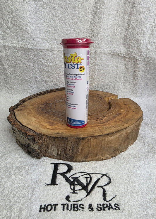 Test strip on a wooden block with RnR Hot Tubs & Spas branding in the background.