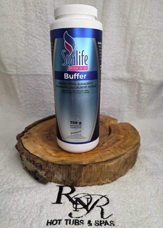 SpaLife Buffer bottle on a wooden block with a towel background