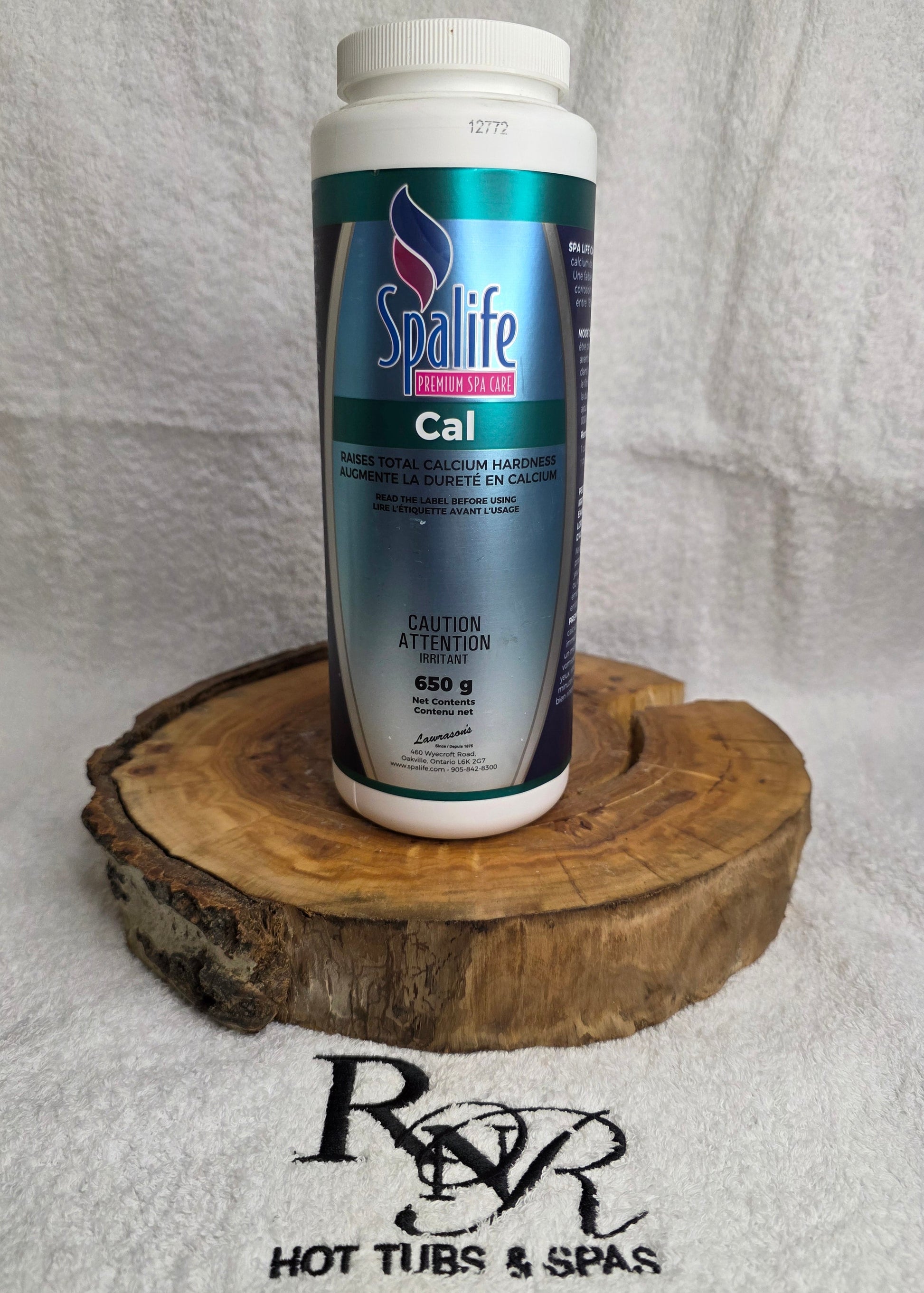 Spalife product bottle on a wooden block with RnR Hot Tubs & Spas branding.