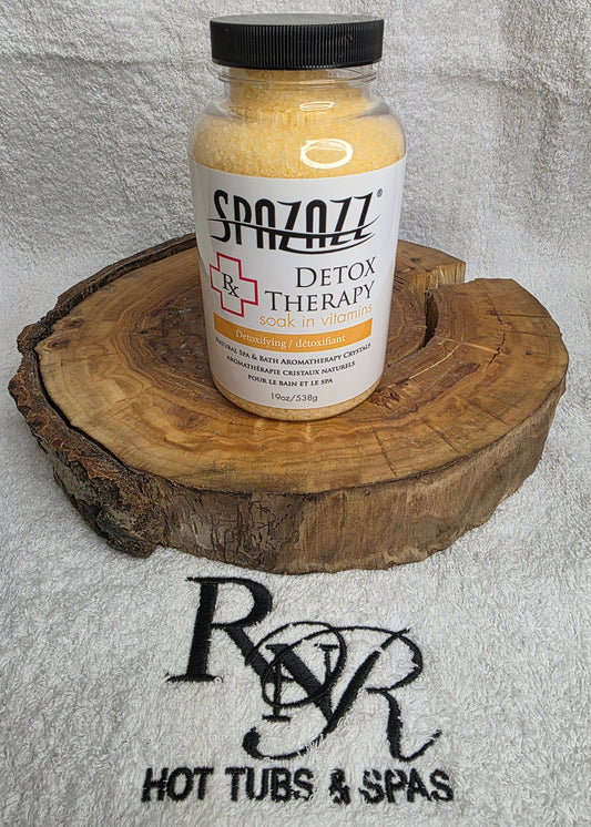 SpaZazz Detox Therapy product on a wooden block with RnR Hot Tubs & Spas branding in the background.