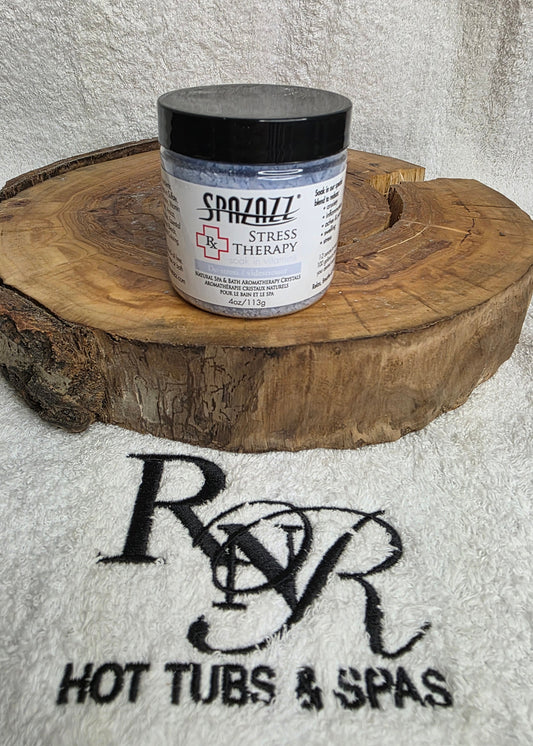 Spazazz Stress Therapy aromatherapy crystals on a wooden block with RnR Hot Tubs & Spas logo in the background