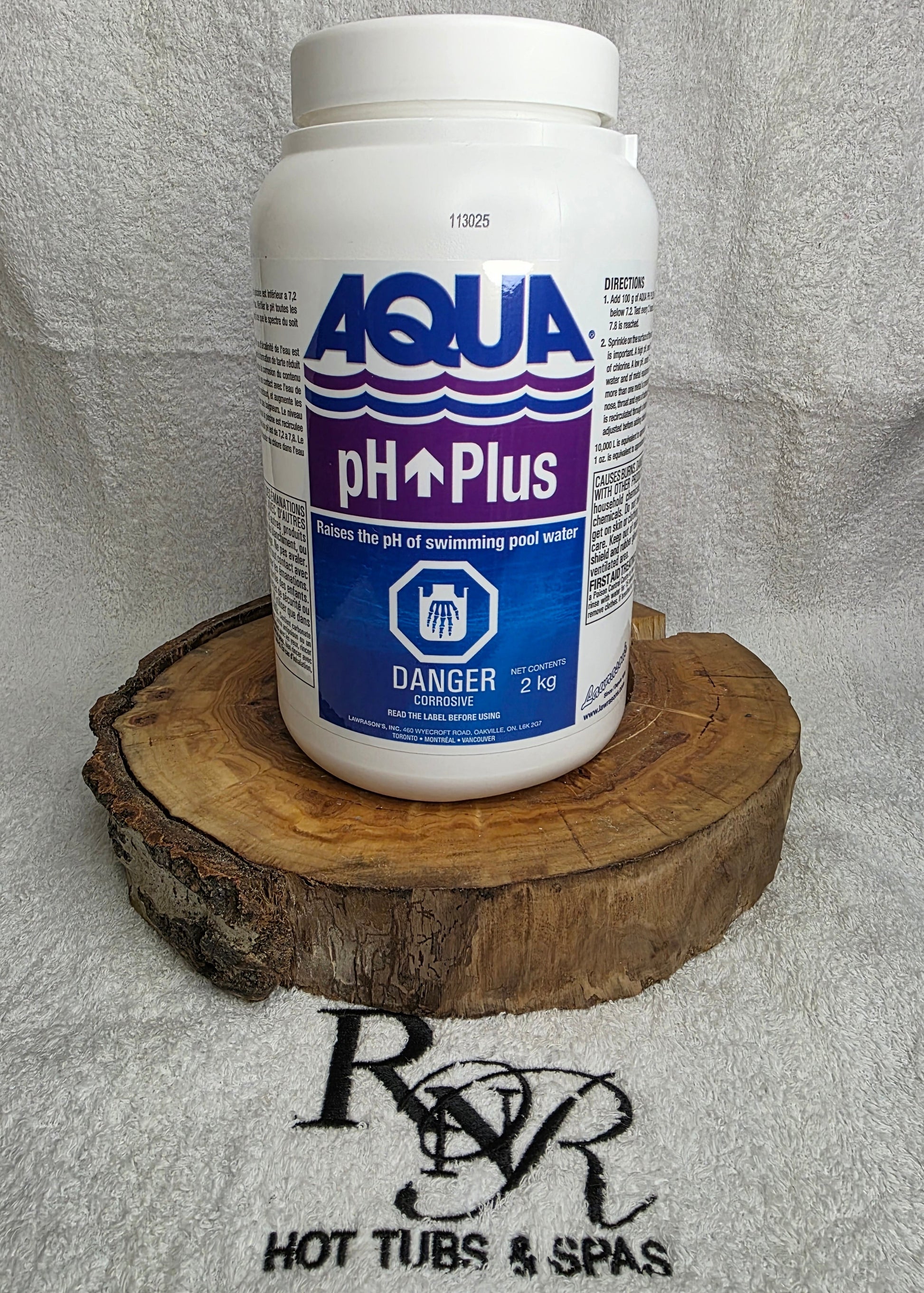 Aqua pH Plus bottle on a wooden block with a brand logo in the background